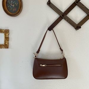 chocolate brown shoulder bag with gold detail